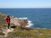 Nirbeeja looks out to sea towards a distant Kangaroo Island